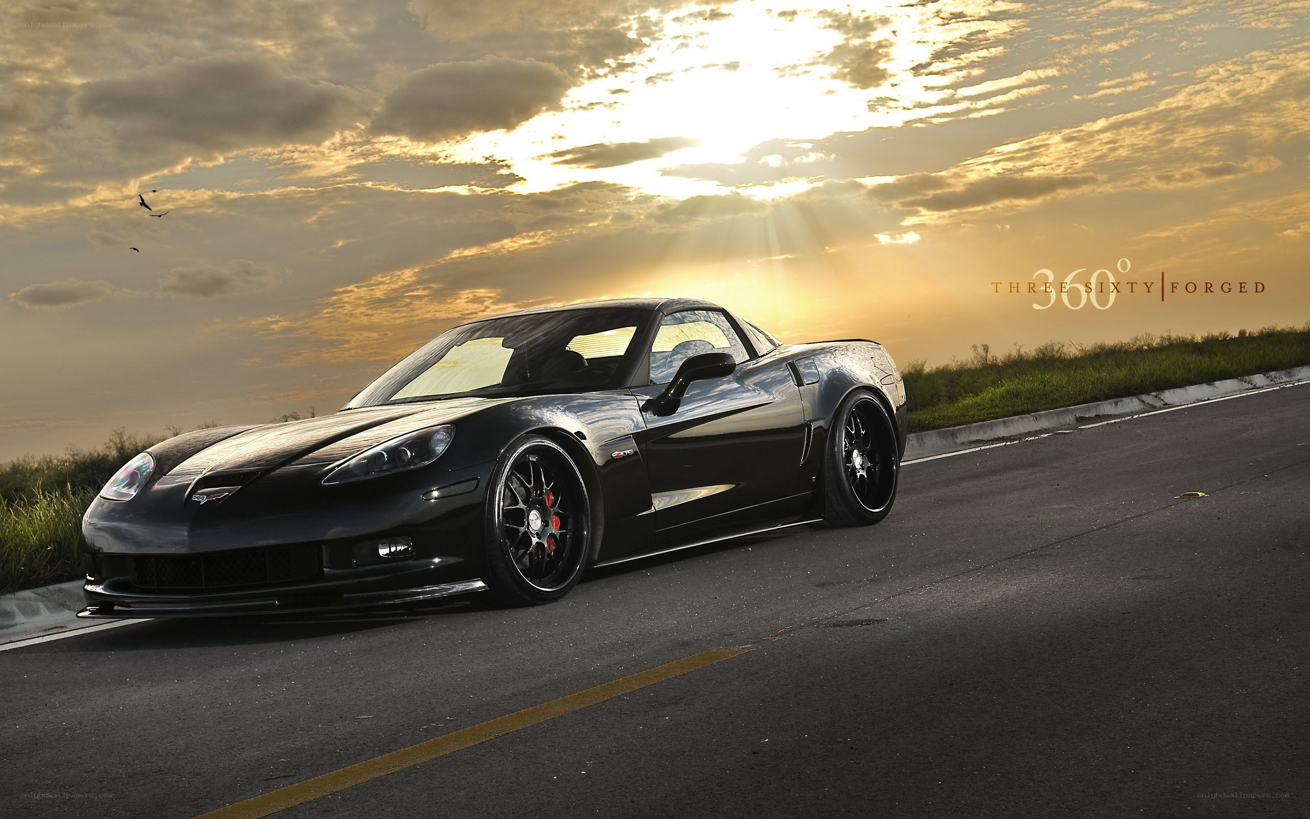 Black Corvette at sunset