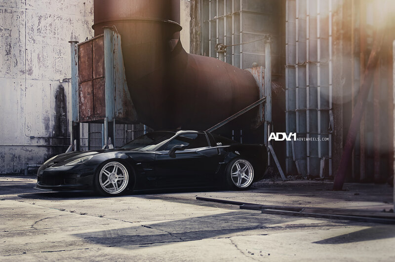 Black Corvette Car — Dramatic, Afternoon, Photograph, Industrial Building