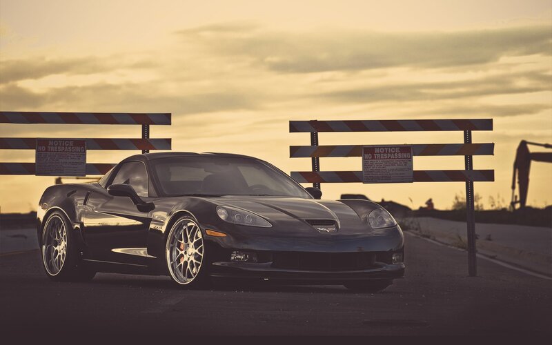 Black Corvette Car — Dramatic, Sunset, Photograph, Barrier