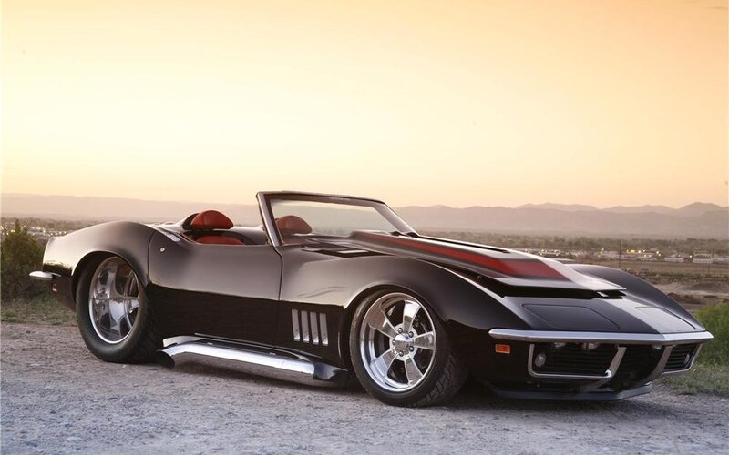 Black Corvette convertible at sunset