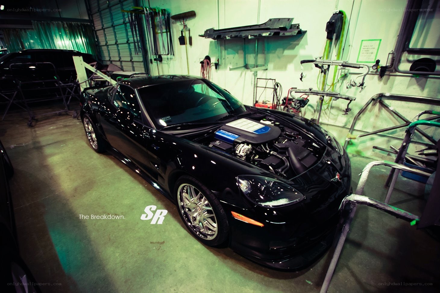 Black Corvette in a garage