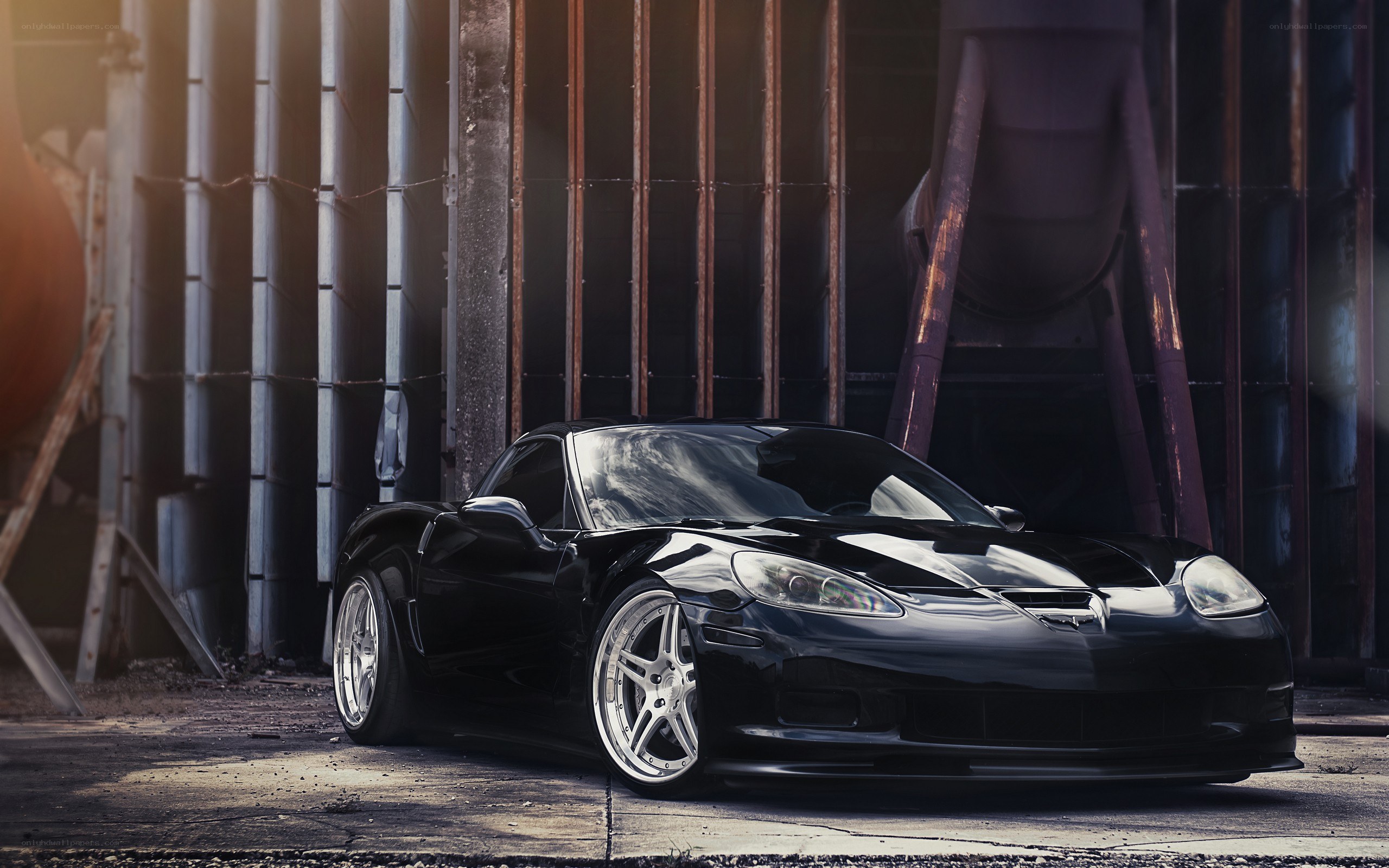 black corvette in industrial setting