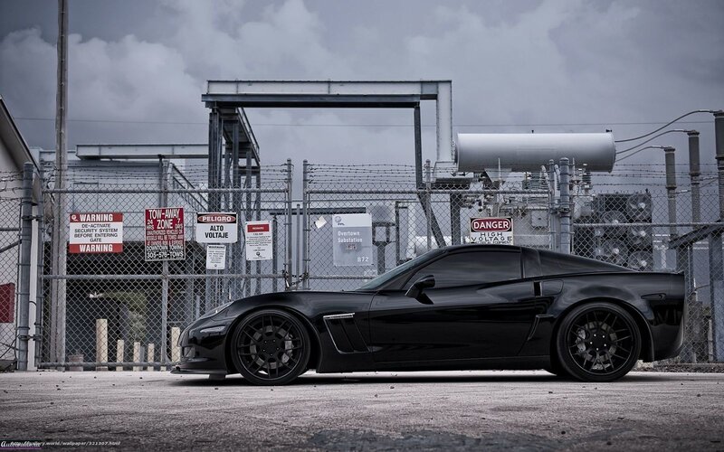 Black Corvette in industrial setting