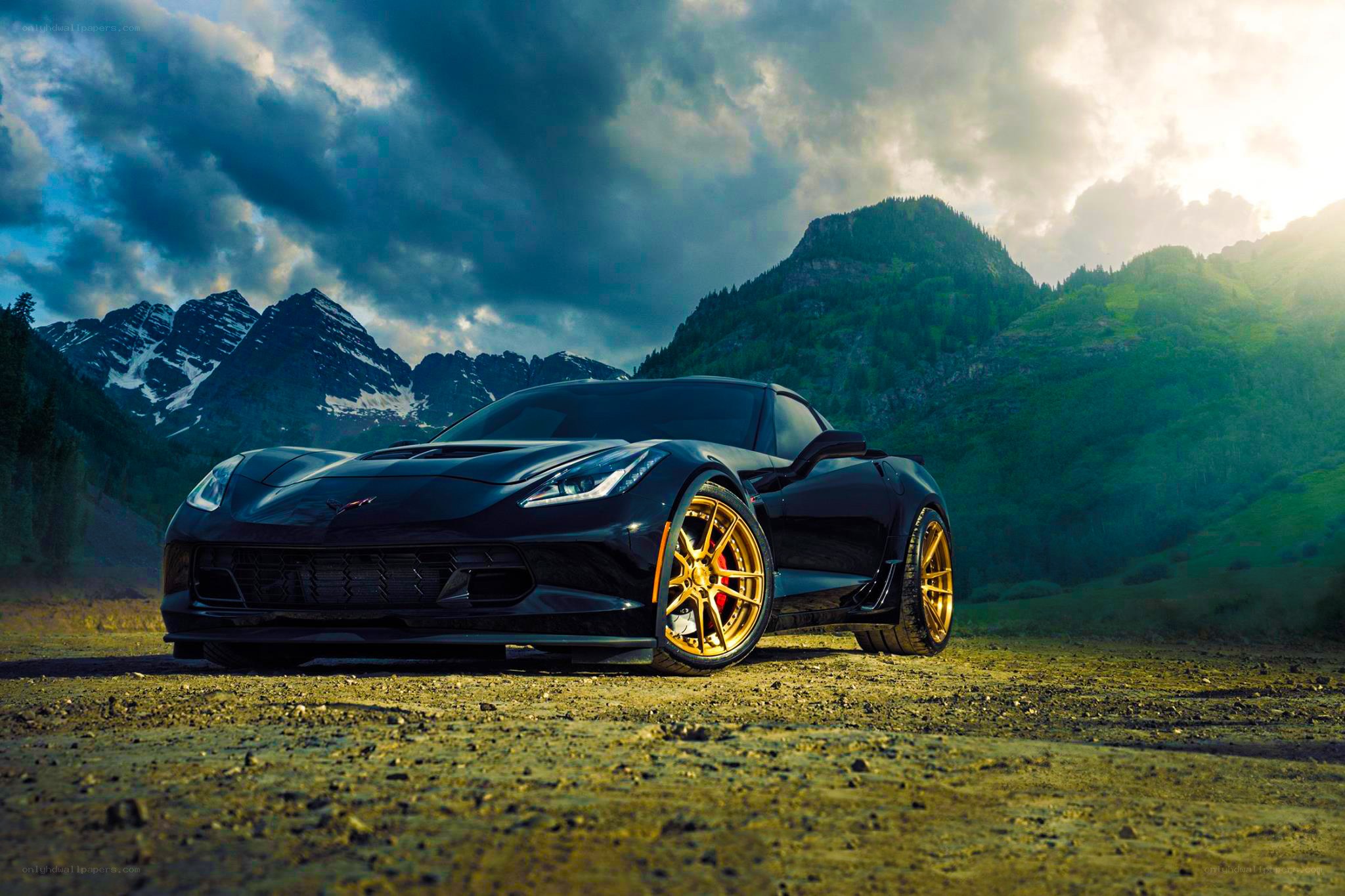 Black Corvette in mountain landscape