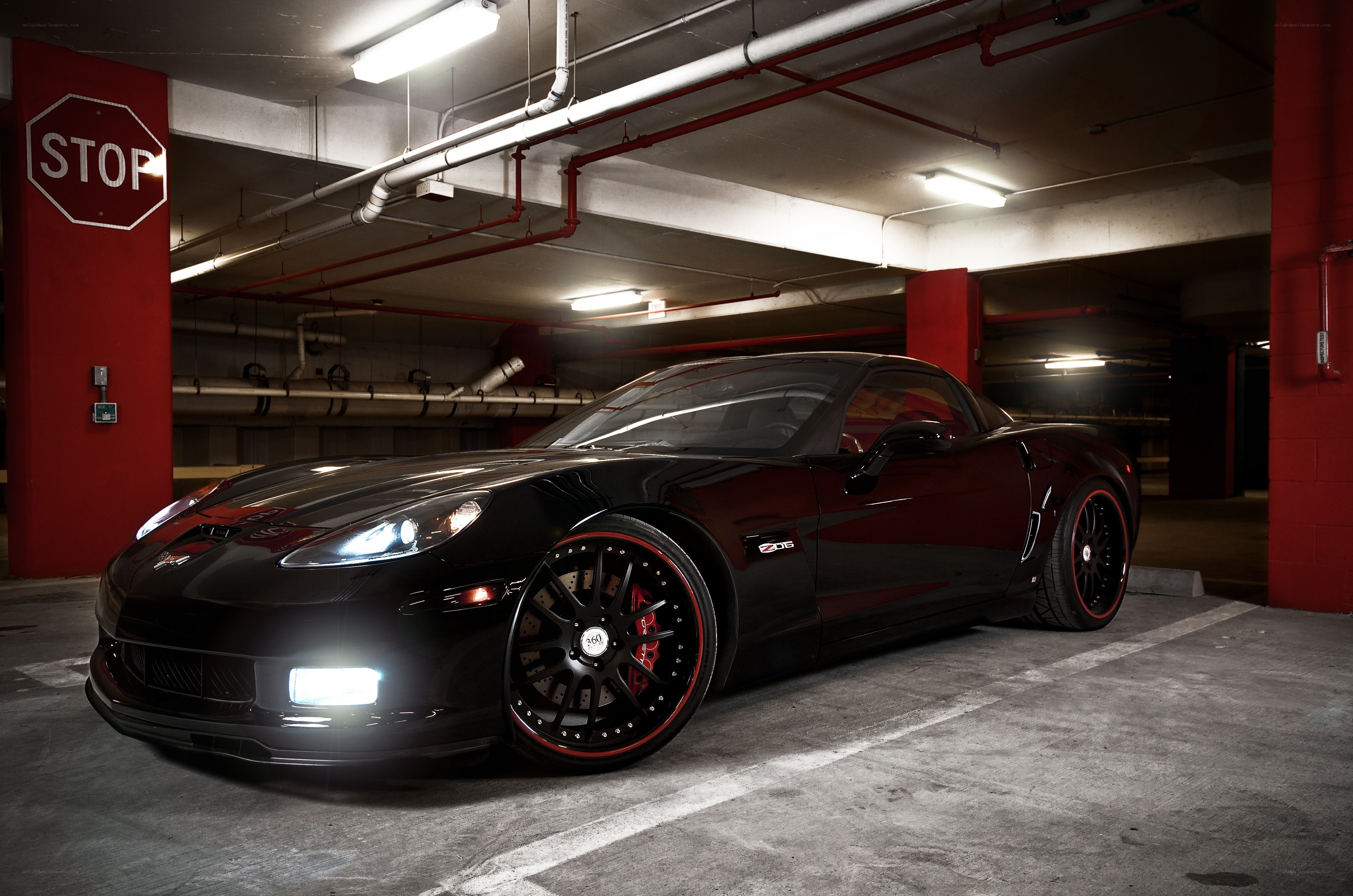 Black Corvette in parking garage