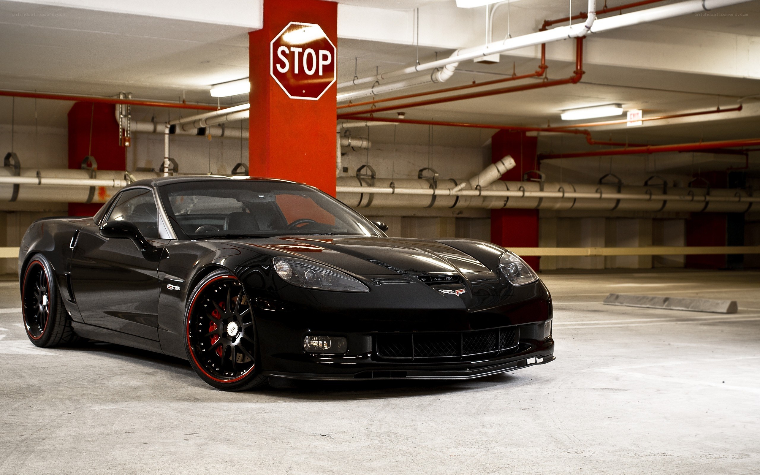 Black Corvette in parking garage