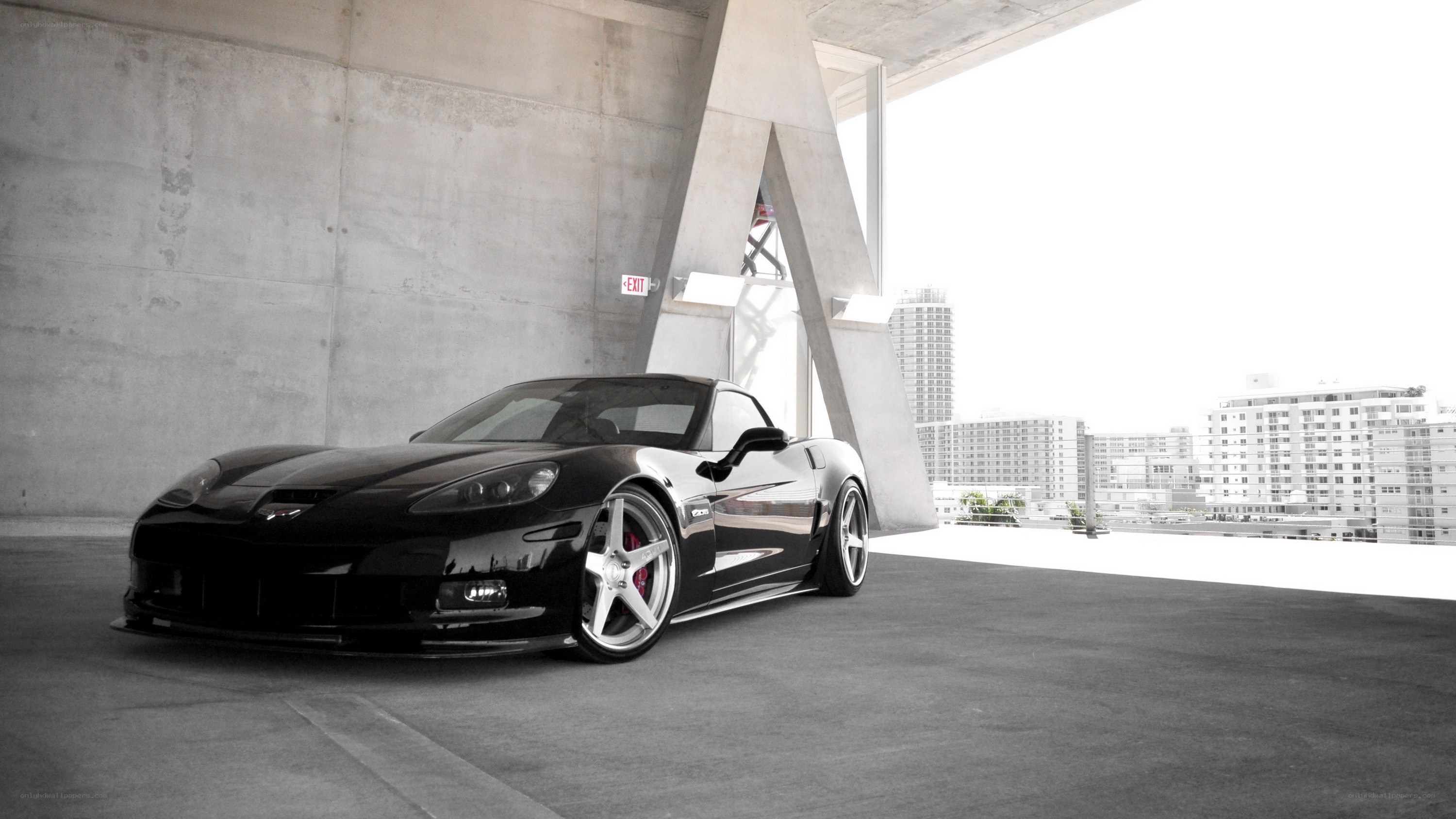black corvette in parking garage