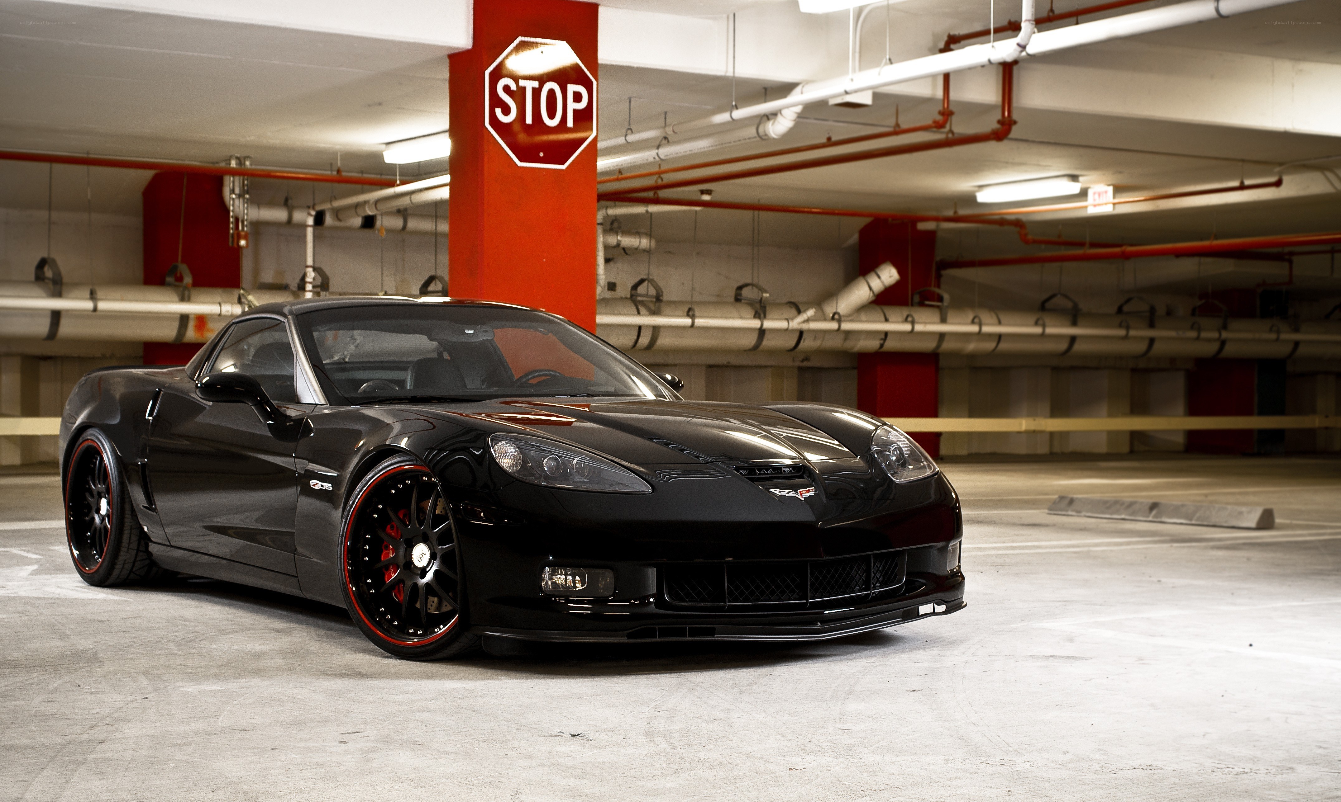 Black Corvette in parking garage