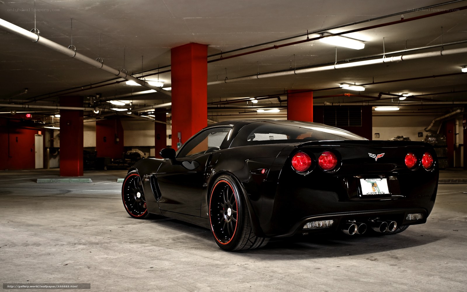Black Corvette in parking garage