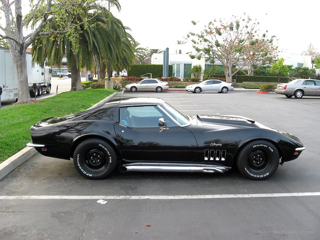 black corvette in parking lot