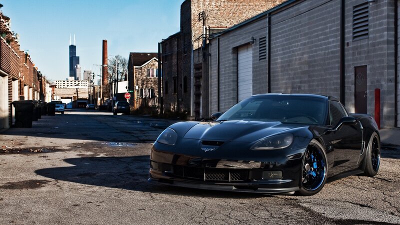 Black Corvette in urban alley