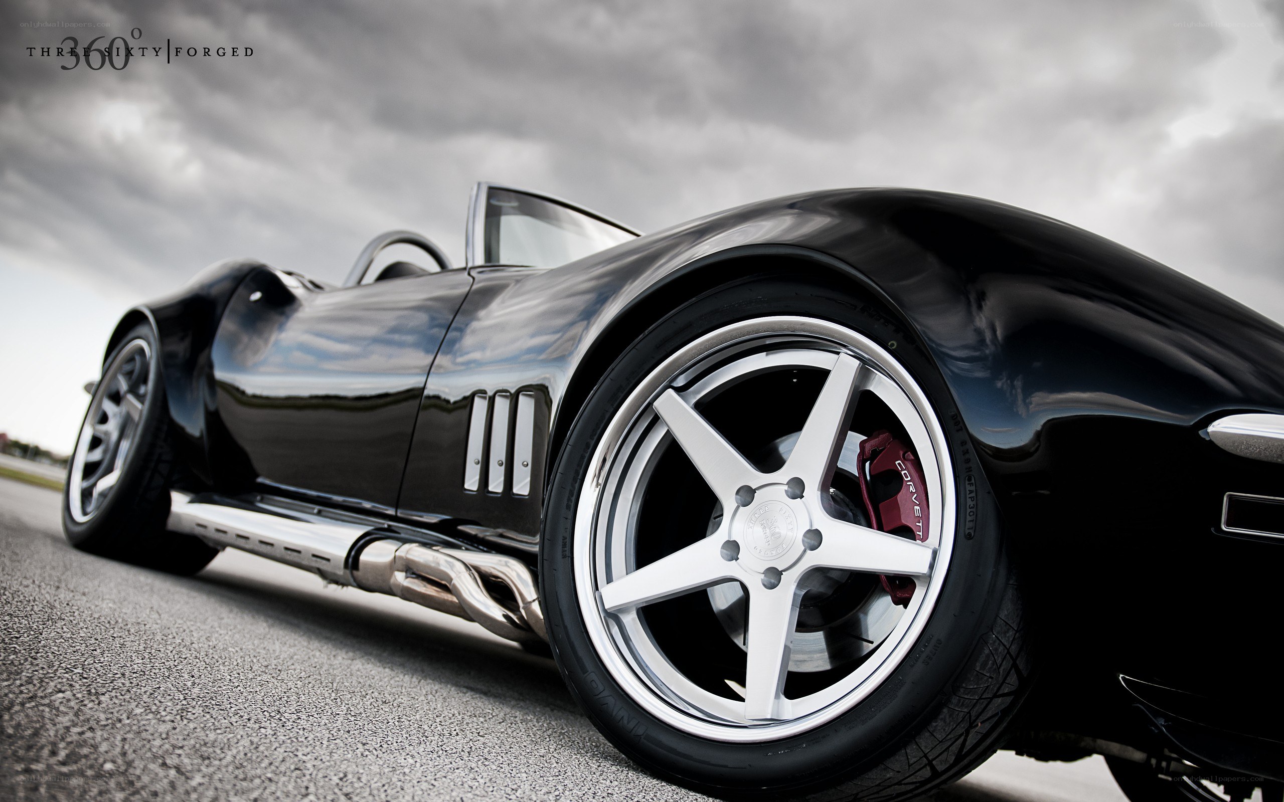 Black Corvette on a racetrack