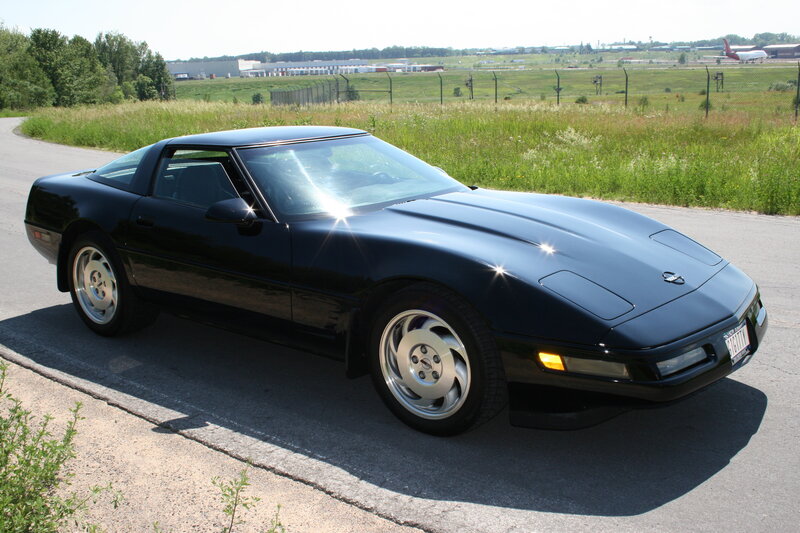 Black Corvette on a road