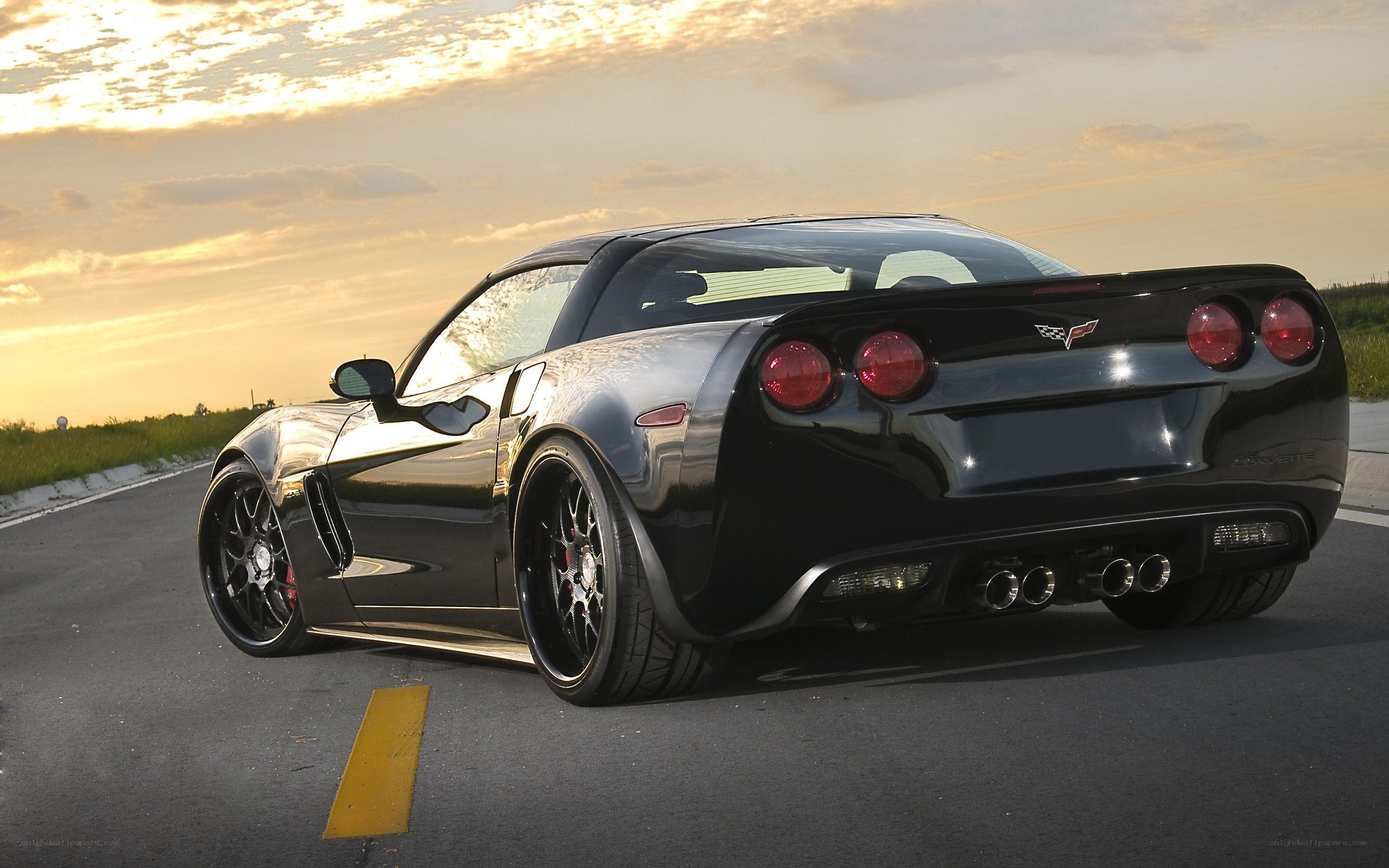 Black Corvette on a road