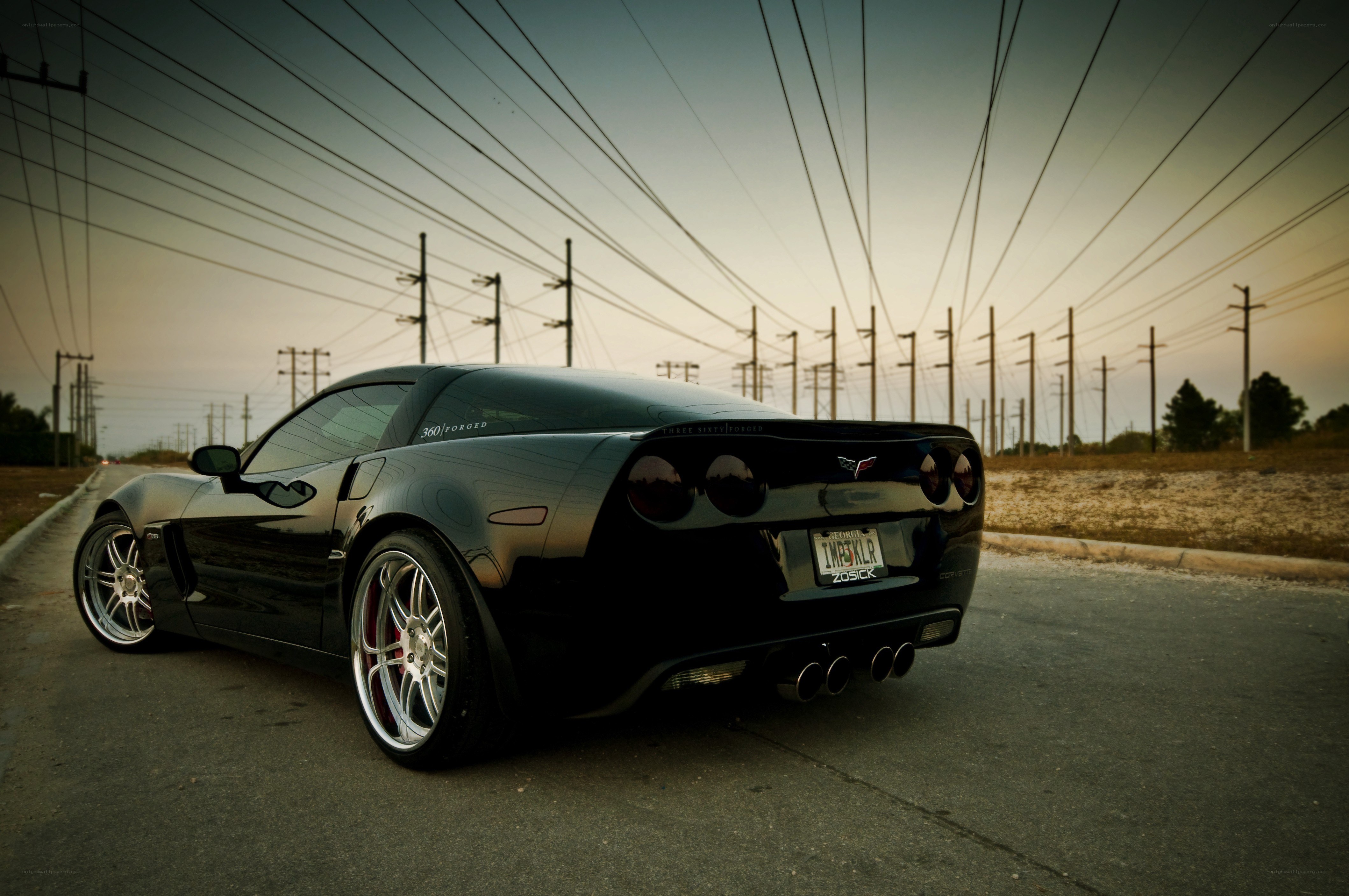 Black Corvette on a road