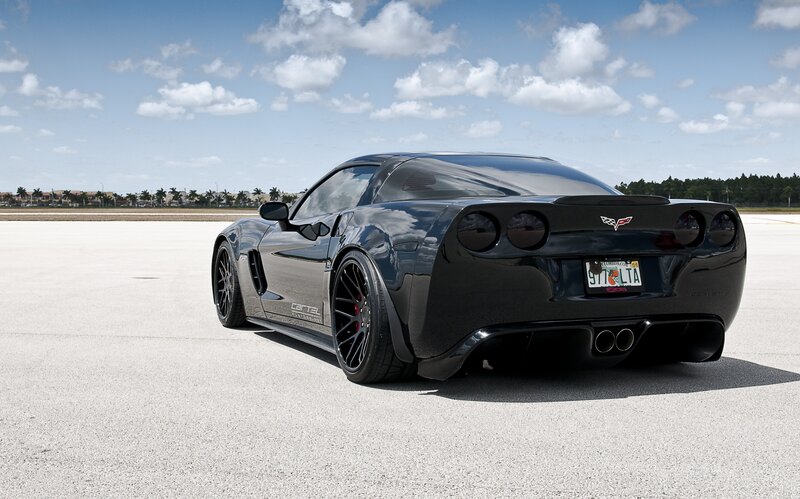 Black Corvette on a tarmac