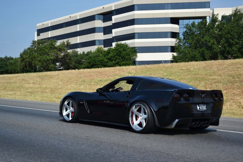 Black Corvette on Road — Calm