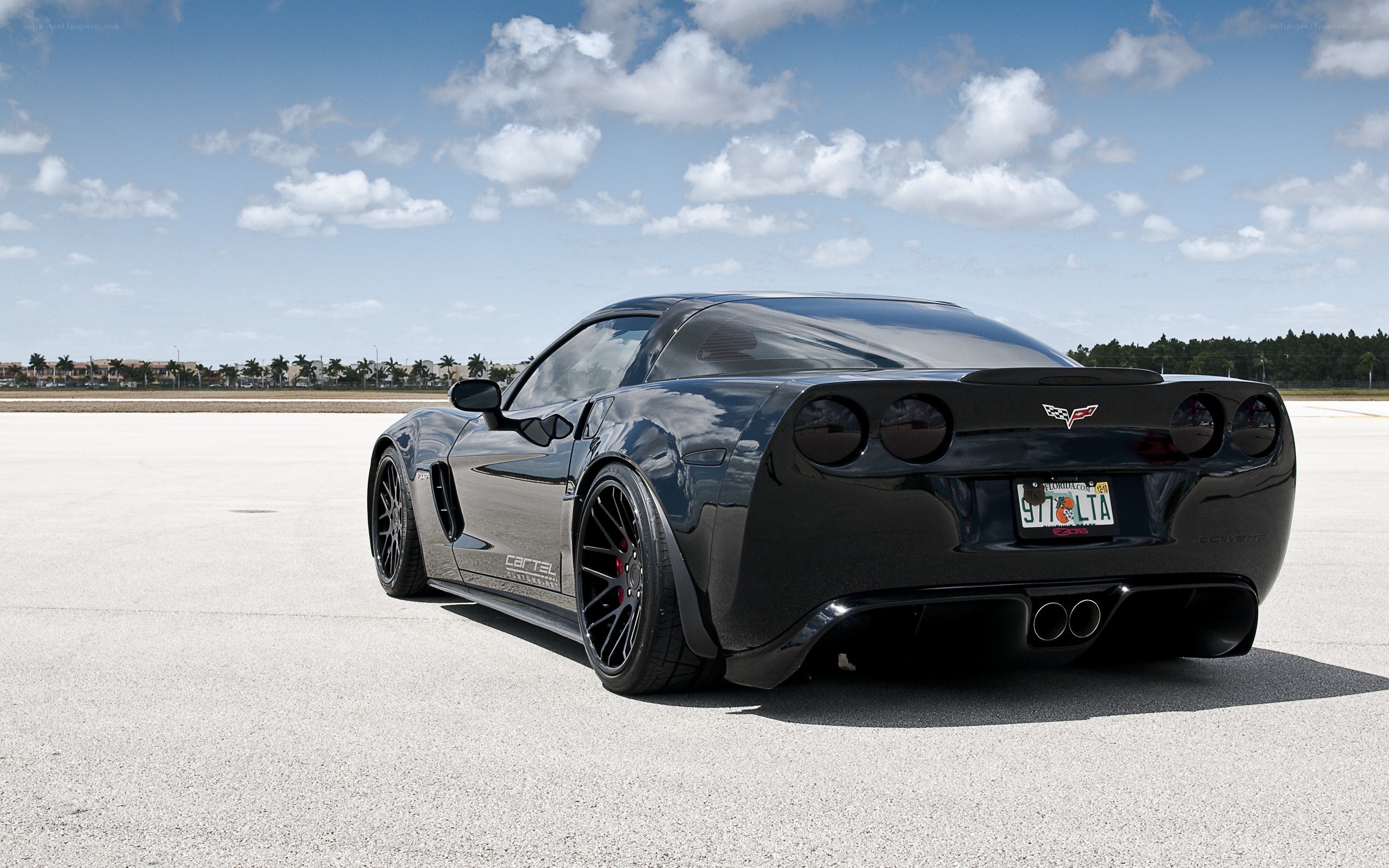Black Corvette on tarmac