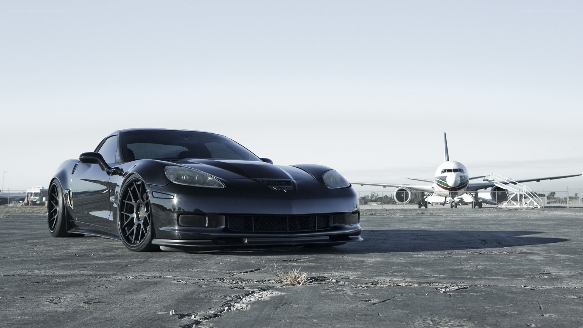 Black Corvette on tarmac