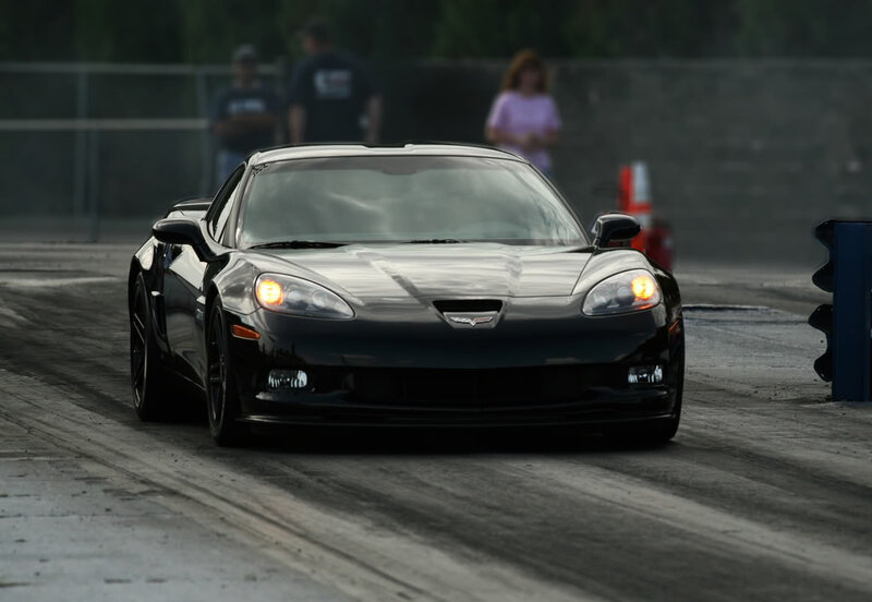 Black Corvette on Track — Dramatic