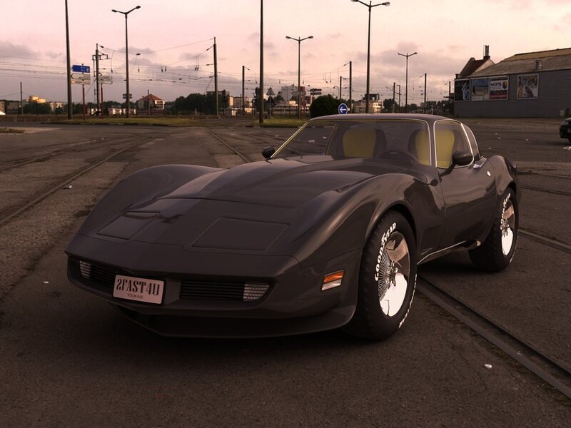 Black Corvette on train tracks