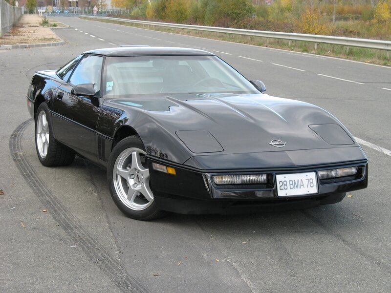 Black Corvette parked on road