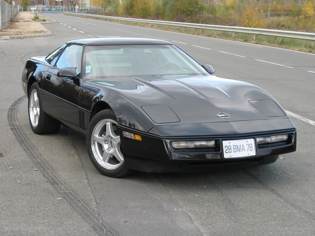 Black Corvette parked on road