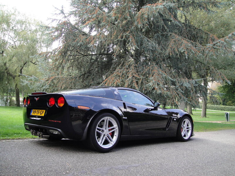 Black Corvette Sports Car — Calm, Afternoon, Photograph, Tree