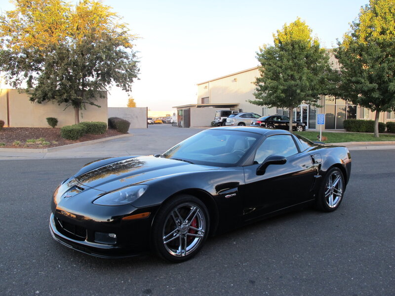 Black Corvette Sports Car — Calm, Afternoon, Photograph, Trees