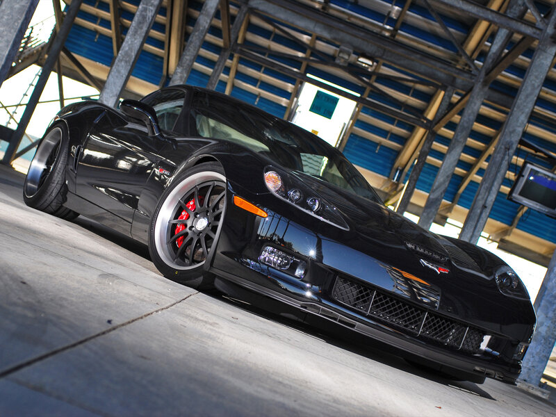 Black Corvette Sports Car — Dramatic, Afternoon, Photograph, Building, Wheels
