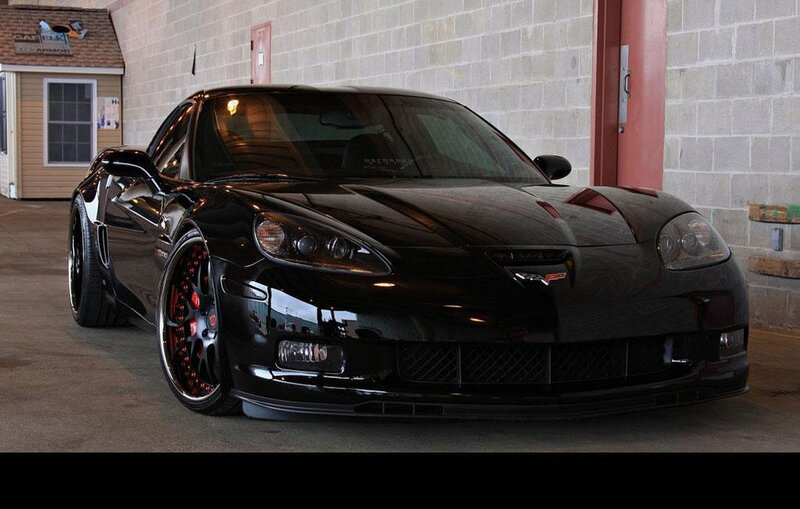 Black Corvette Sports Car — Dramatic, Photograph, Building, Concrete Floor