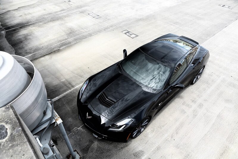Black Corvette Sports Car — Dramatic, Photograph, Concrete Surface