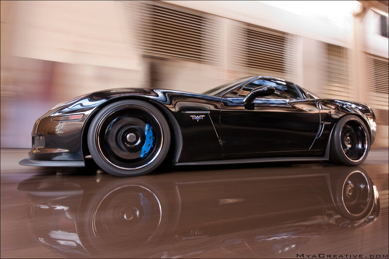 Black Corvette Sports Car — Dynamic, Photograph, Blue Brake Calipers
