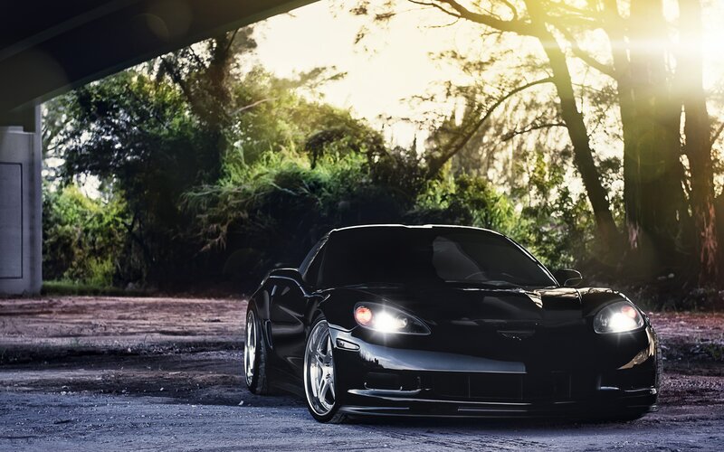 black corvette under bridge