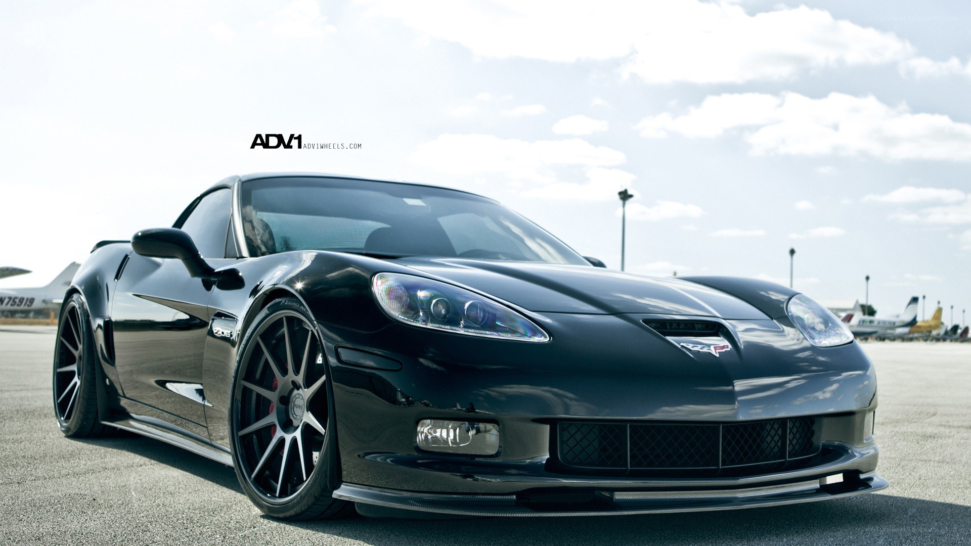 Black Corvette with custom wheels