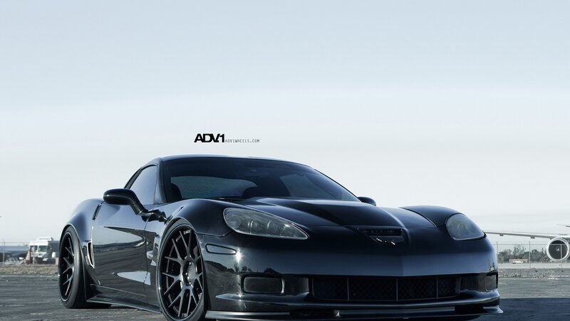 black corvette with custom wheels