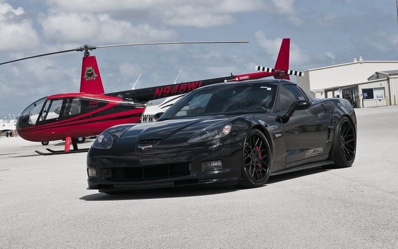 Black Corvette with helicopter