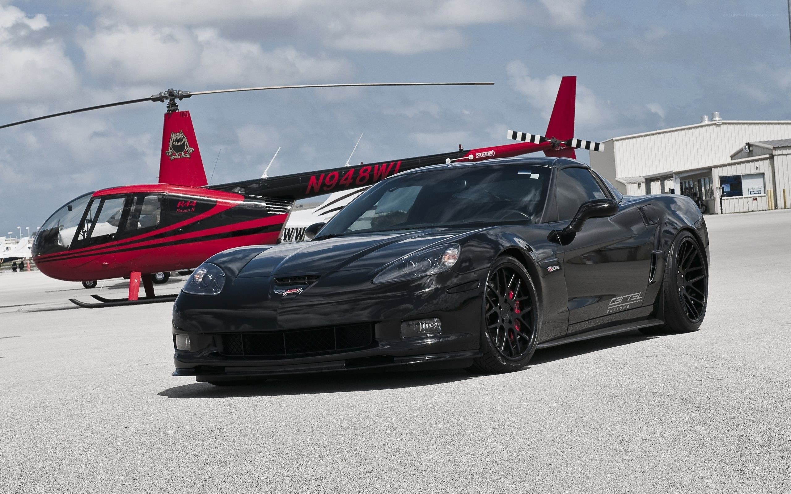 Black Corvette with helicopter