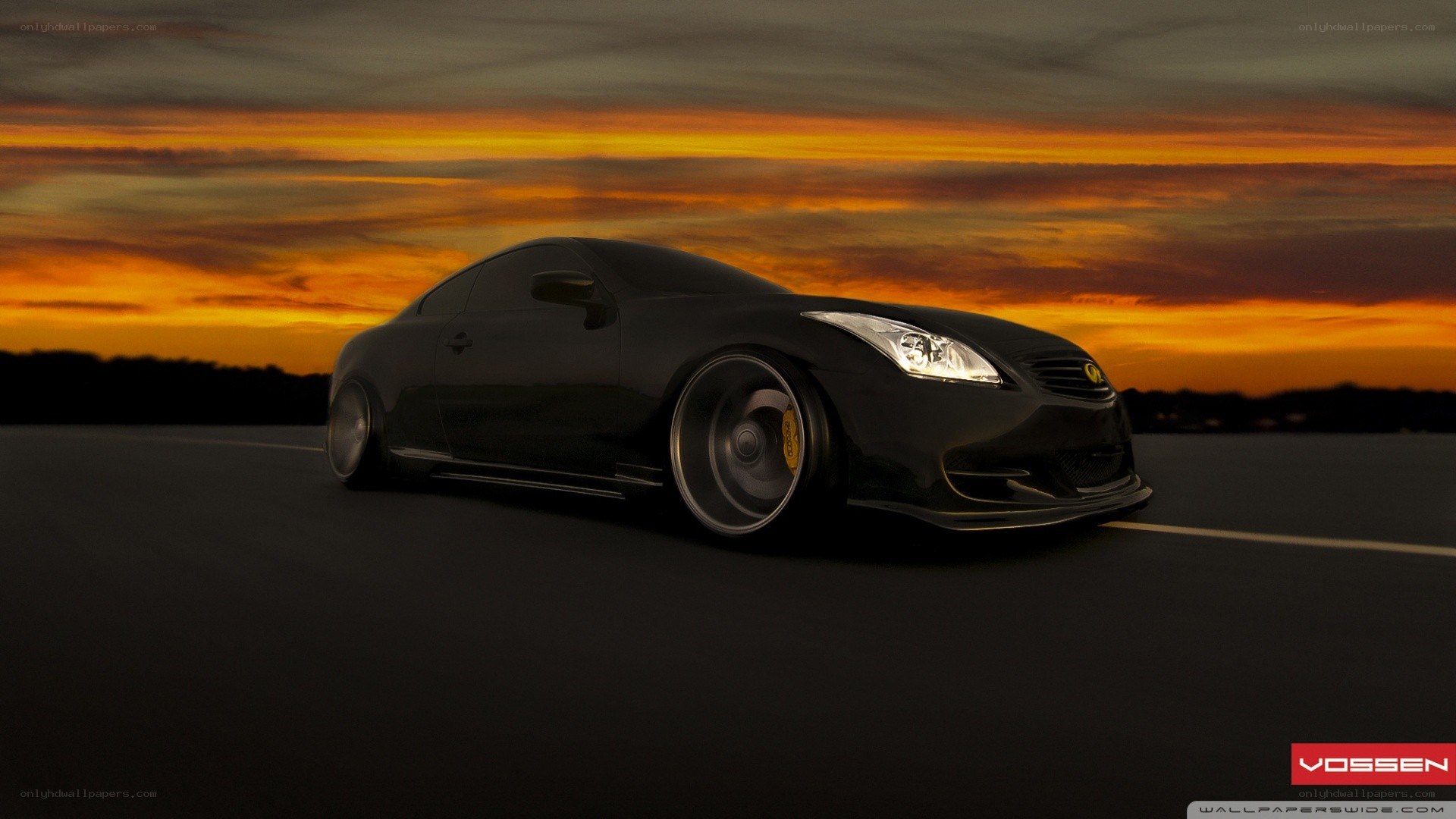Black coupe at sunset
