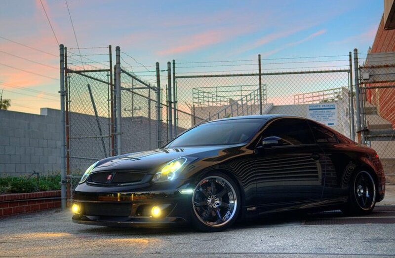black coupe at sunset