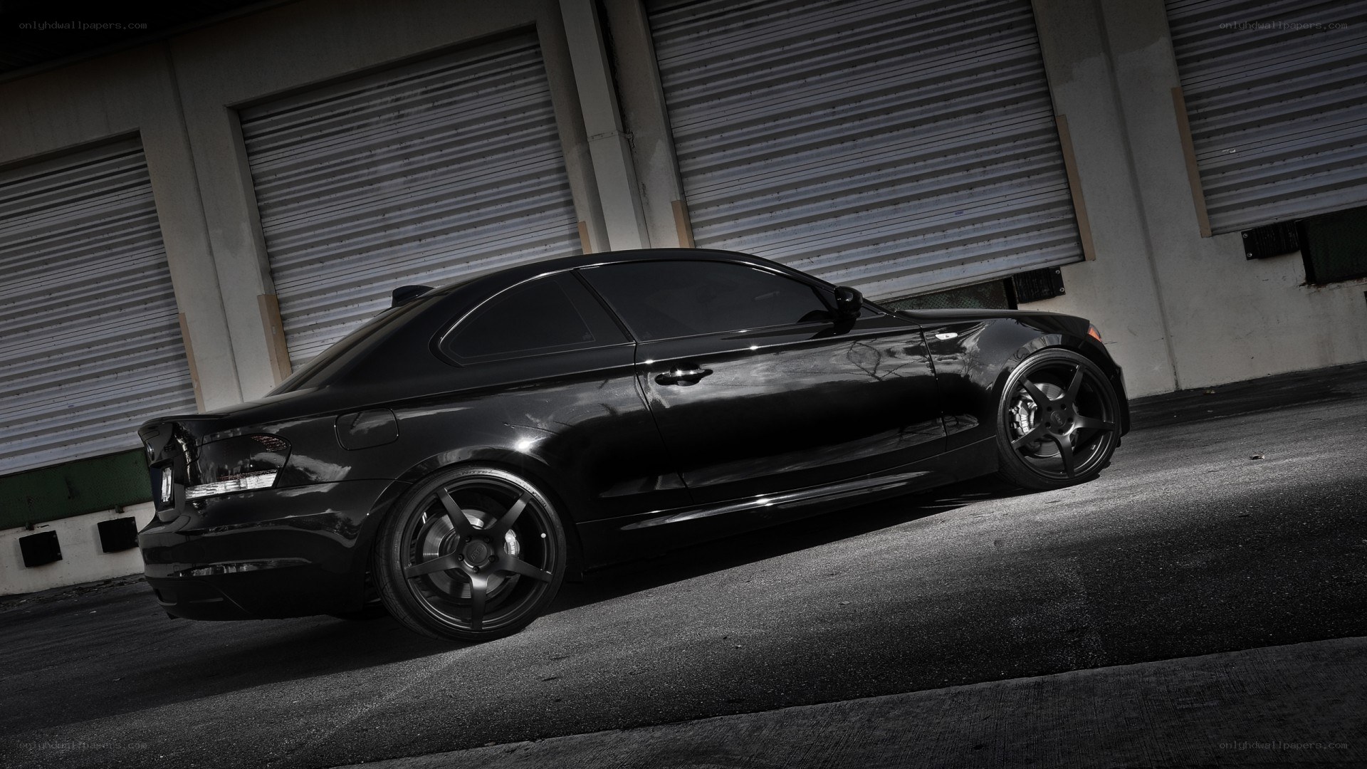 black coupe car in garage