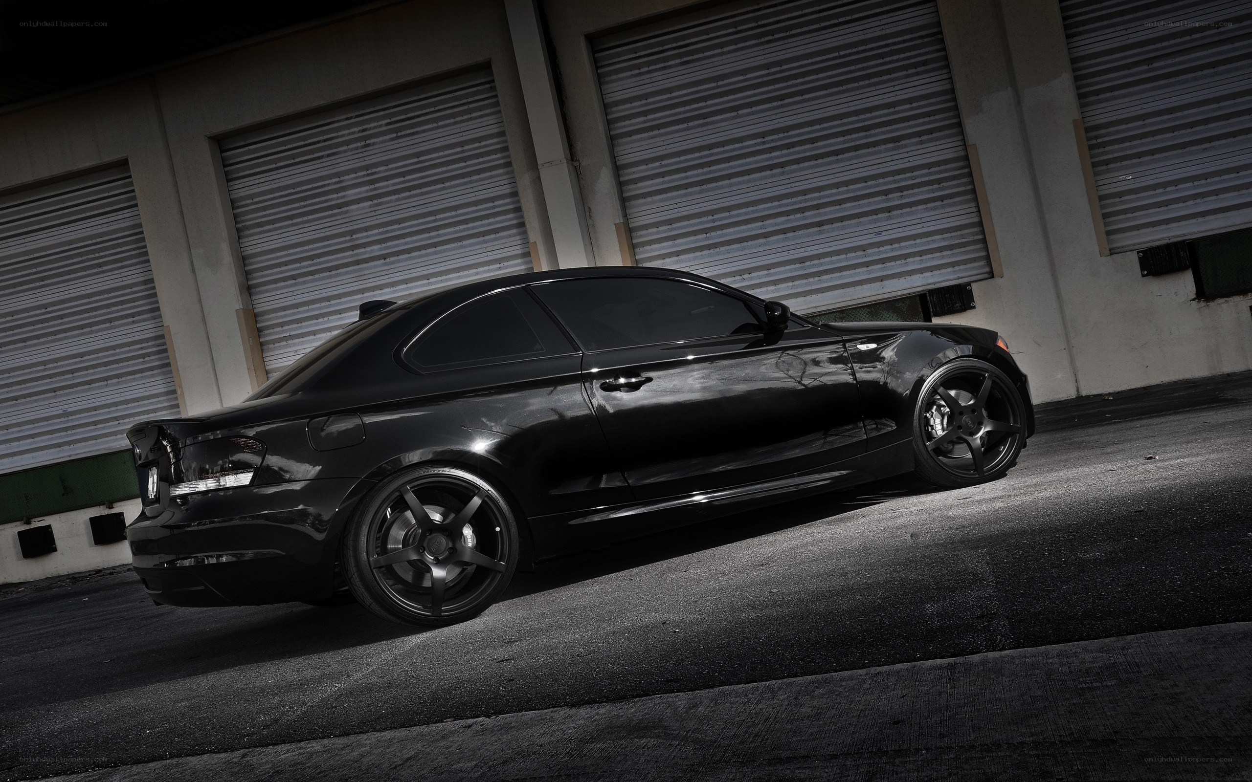 black coupe car in garage