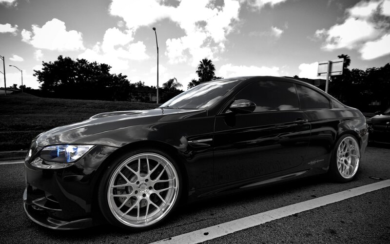 black coupe car in parking lot