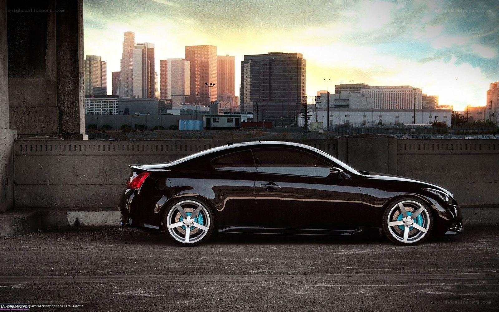 Black coupe in cityscape