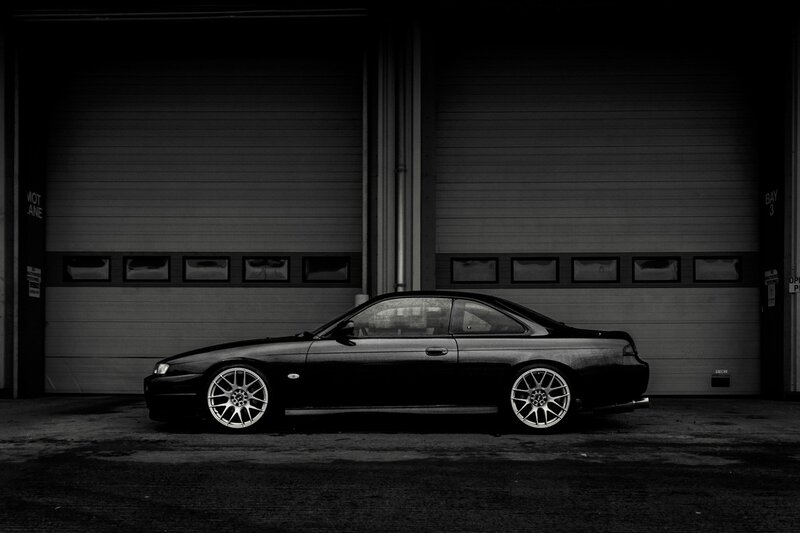 black coupe in garage