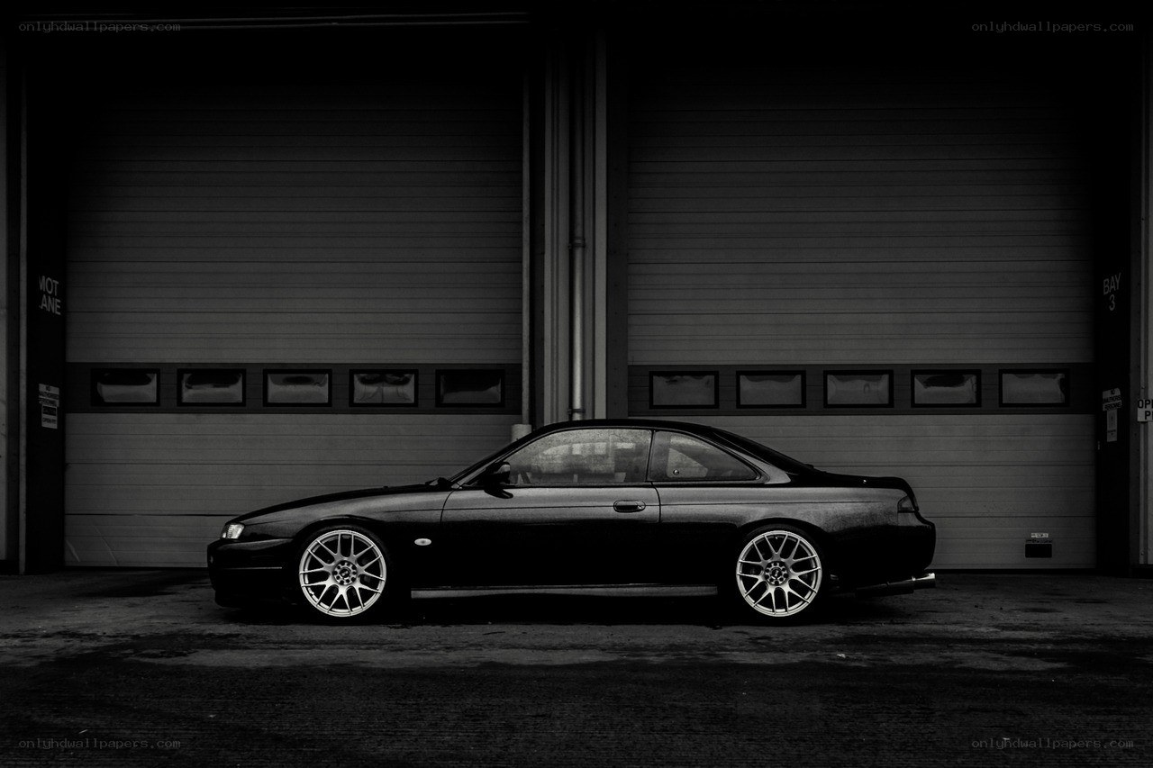 black coupe in garage