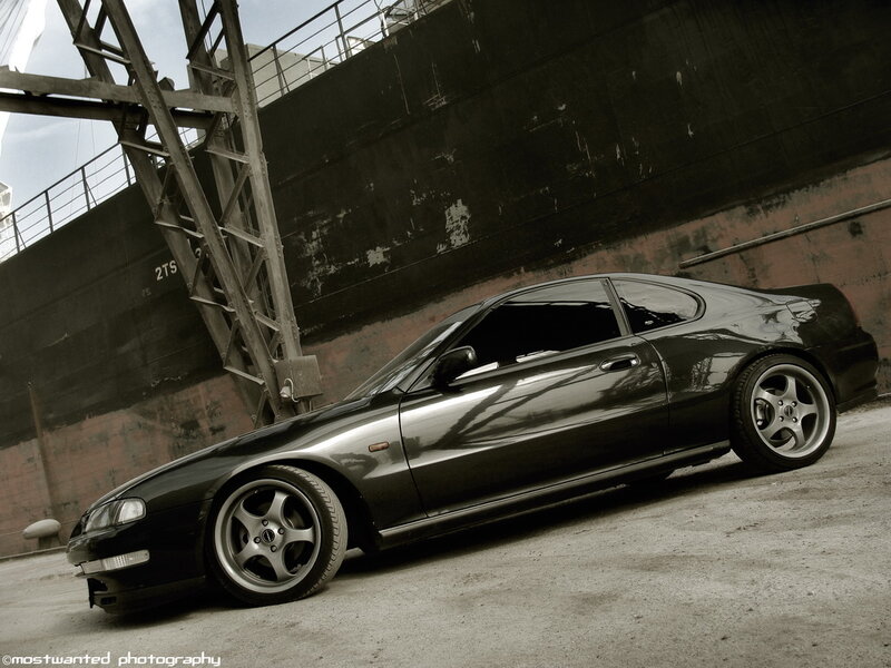 black coupe in industrial setting