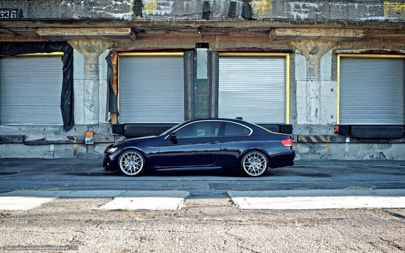 black coupe in industrial setting