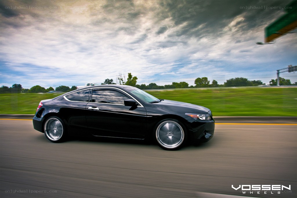 black coupe in motion