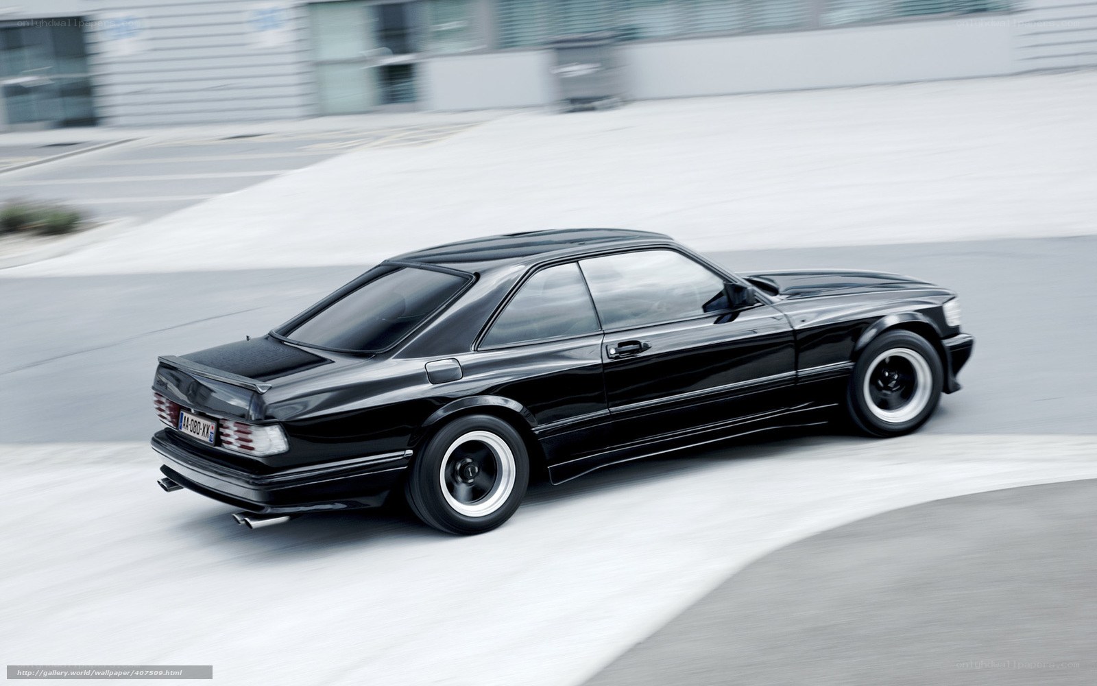 black coupe in motion